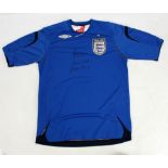 GORDON BANKS AND PETER SHILTON; a double signed replica blue England football shirt.