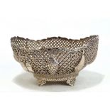 A circa 1900 Persian white metal oval basket with pierced sides embossed with various fruits, on