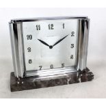 JAEGER LECOULTRE; an Art Deco mantel clock with chromed frame enclosing square clear glass dial
