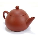 A Chinese Yixing teapot with four character seal mark to base, length 13cm.Additional