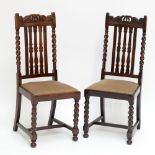 A set of four early 20th century oak dining chairs on barleytwist supports (4).