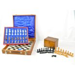 A cased 20th century onyx and marble chess set and further wooden chess pieces in oak box (2).