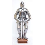 A 14th century style suit of armour with pig faced bascinet and sword, on stand, height including