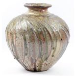 ALEX SHIMWELL (born 1980); a stoneware vase covered in shino and ash glaze with iron and manganese