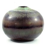 ABDO NAGI (1941-2001); a stoneware globular vessel covered in streaky purple and green glaze,
