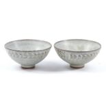 GWYN HANSSEN-PIGOTT (1935-2013); a pair of early stoneware bowls covered in grey ash glaze,
