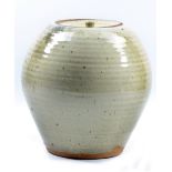 PHIL ROGERS (born 1951); a stoneware jar and cover with pronounced ribbing covered in speckled cream