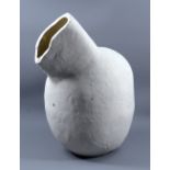 GORDON BALDWIN (born 1932); a white earthenware vessel with flute covered in white pigment,