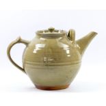 GWYN HANSSEN-PIGOTT (1935-2013); an early stoneware teapot covered in grey/green ash glaze,