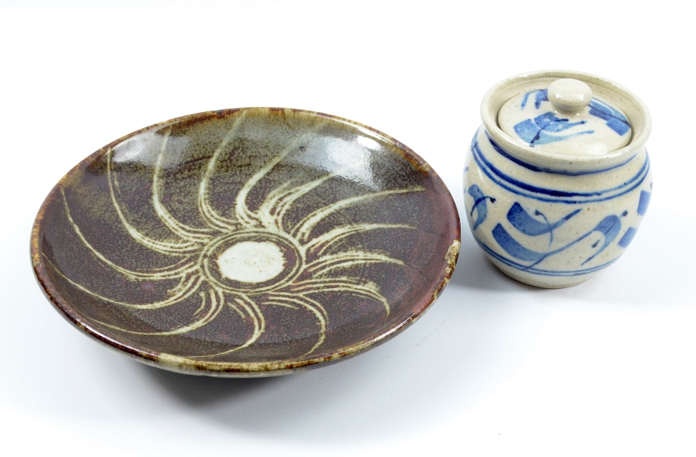 URSULA MOMMENS (1908-2010); a stoneware dish covered in tenmoku and dolomite glaze with radiating