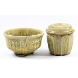 MIKE DODD (born 1943); a stoneware bowl and caddy both covered in green ash glaze with incised
