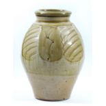 PHIL ROGERS (born 1951); a cut-sided stoneware vase partially covered in green ash glaze with