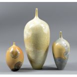 PETER ILSLEY (1932-2014); three porcelain narrow-necked vases covered in crystalline glaze,