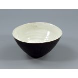 LUCIE RIE (1902-1995); a oval buff stoneware bowl, white pitted glaze to interior, manganese to