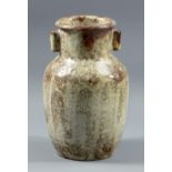 REGINALD FAIRFAX WELLS (1877-1951); a stoneware shouldered vase with lug handles covered in a