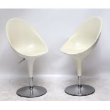 STEFANO GIOVANNONI FOR MAGIS; a pair of white plastic and chrome 'Bombo' adjustable swivel chairs (