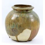 ISKANDAR JALIL; a stoneware collared vase partially covered in running green glaze, incised