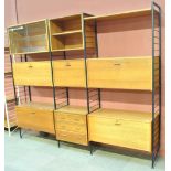 LADDERAX; a teak wall unit comprising four ladders, glazed cabinet, open cabinet, two cocktail