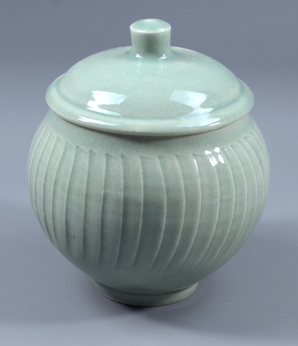 DAVID LEACH (1911-2005) for Lowerdown Pottery; a fluted porcelain jar and cover, green celadon