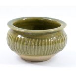 KATHARINE PLEYDELL-BOUVERIE (1895-1985); a fluted stoneware bowl covered in green ash glaze,