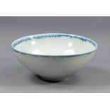 EDMUND DE WAAL (born 1964); a porcelain bowl covered in pale celadon glaze with cobalt rim,