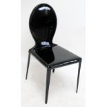 A black PVC side chair.