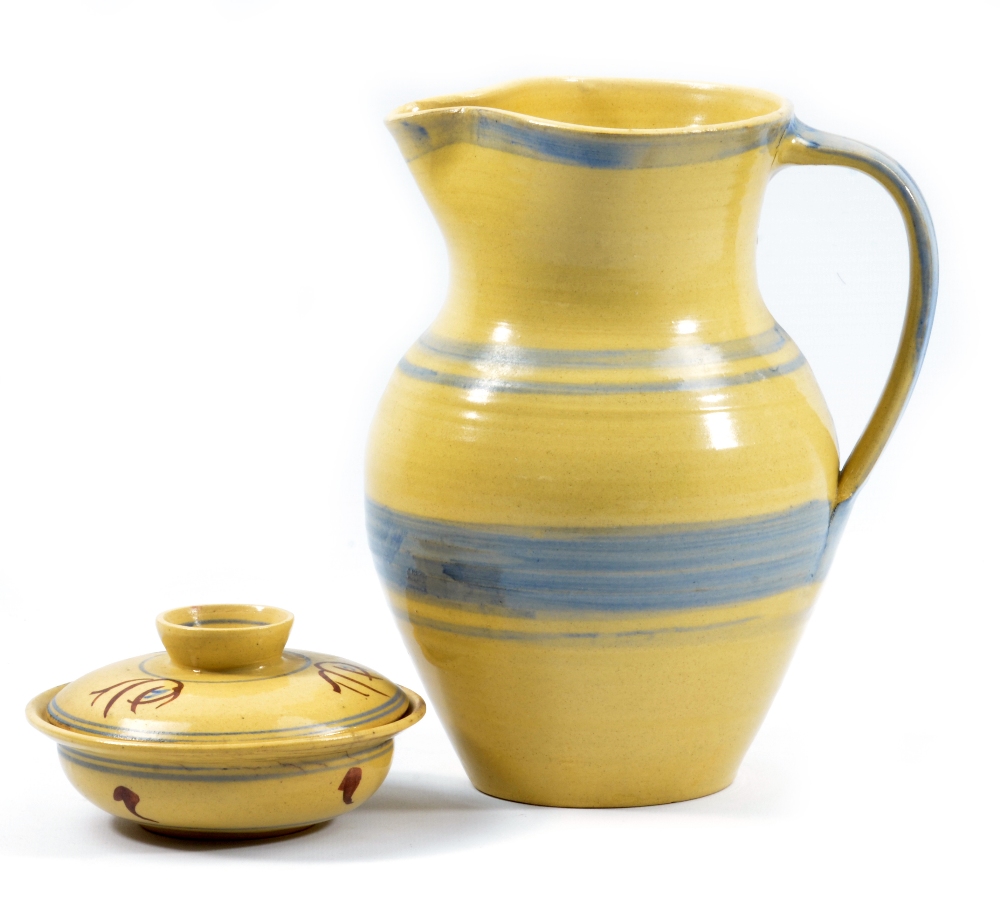 Kingwood Pottery; a stoneware jug decorated with bands of blue on a pale yellow ground, impressed