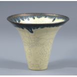 BOB KERSHAW; a stoneware vase of flared form covered in cream crackle glaze with running bronze rim,