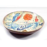 BEN FOSKER (born 1960); a large slip decorated earthenware dish depicting a hare, painted signature,