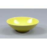 RUPERT SPIRA (born 1960); a small stoneware bowl covered in bright yellow glaze, impressed RS