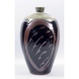 MARK GRIFFITHS (born 1956); a stoneware bottle decorated with grasses on a tenmoku ground with