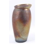JOANNA CONSTANTINIDIS (1927-2000); a leaning lustred stoneware pot with rim, impressed C mark,