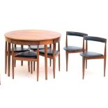 HANS OLSEN FOR FREM ROJLE; a circa 1960s Danish teak extending dining table of circular form,