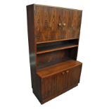 A circa 1970s Scandinavian rosewood veneered dresser, with twin cupboard doors above a shelf and