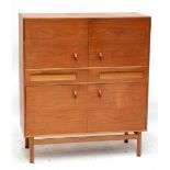 A.H. MCINTOSH & CO; a c.1960s teak cabinet with a cutlery and further drawer set between two sets of