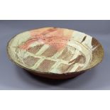 MARCUS O'MAHONY (born 1952); a large stoneware platter, wood-fired, impressed 'O mark, diameter 48.