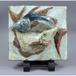 COLIN KELLAM (born 1942); a large square stoneware plaque with two fish in high relief, 28 x