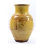 RAY FINCH (1914-2012) for Winchcombe Pottery; a early large slipware baluster vase covered in yellow