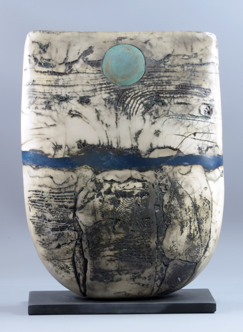 PETER HAYES (born 1946); a very large raku bow mounted on slate base, fractured smoky white surface,