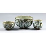 ALEX SHIMWELL (born 1980); two stoneware footed bowls and a yunomi, porcelain slip and celadon