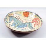 BEN FOSKER (born 1960); a large slip decorated earthenware dish depicting a horse, painted