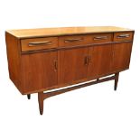 G-PLAN; A 'Fresco' teak sideboard with three drawers above four cupboard doors raised on square