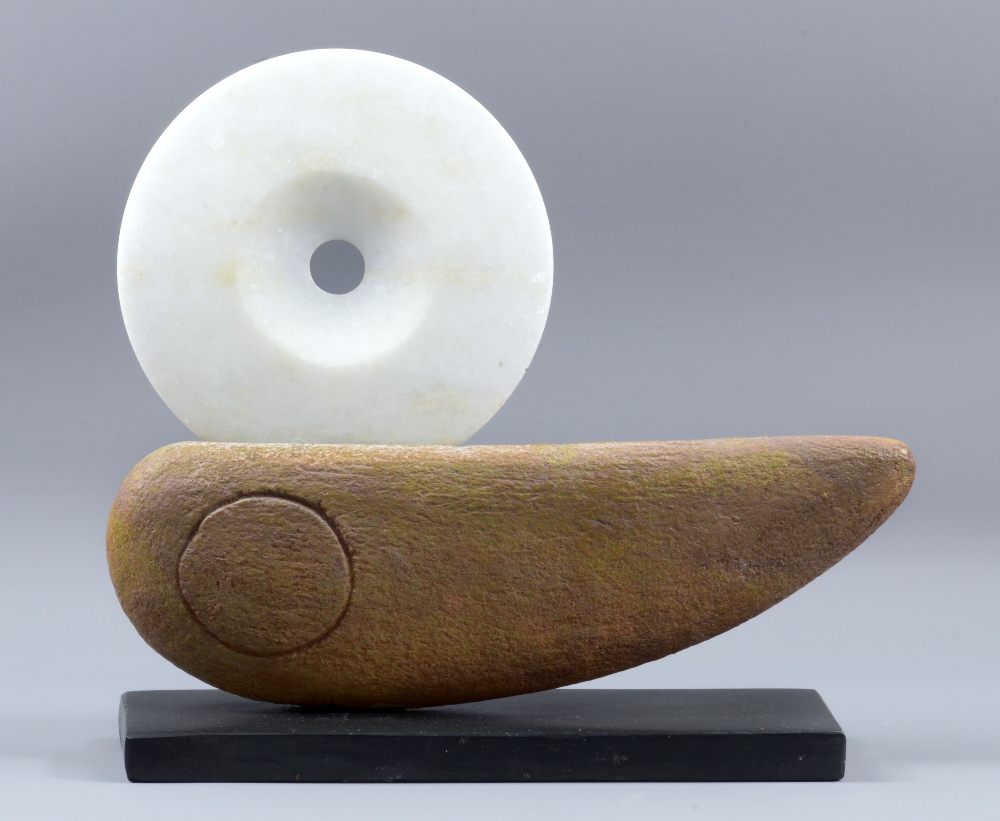 PETER HAYES (born 1946); a stoneware and polished white marble boat form mounted on slate base,