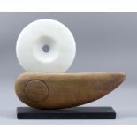 PETER HAYES (born 1946); a stoneware and polished white marble boat form mounted on slate base,