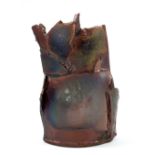 PETERIS MARTINSONS (1931-2013); a small earthenware sculpture covered in metallic glaze, incised