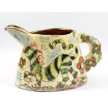 BEN FOSKER (born 1960); a oval slip decorated earthenware jug depicting a tiger, height 17.5cm.