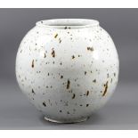 ADAM BUICK (born 1978); a porcelain moon vase covered in white glaze with iron spots, impressed AB