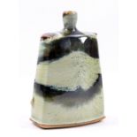 JAMES HAKE (born 1979); a small stoneware bottle covered in nuka ash and tenmoku glaze, impressed JH