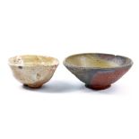 CHARLES BOUND (born 1939); two stoneware footed bowls, wood-fired, impressed marks, largest diameter
