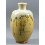 JIM MALONE (born 1946); a stoneware bottle covered in green ash glaze and nuka top with incised